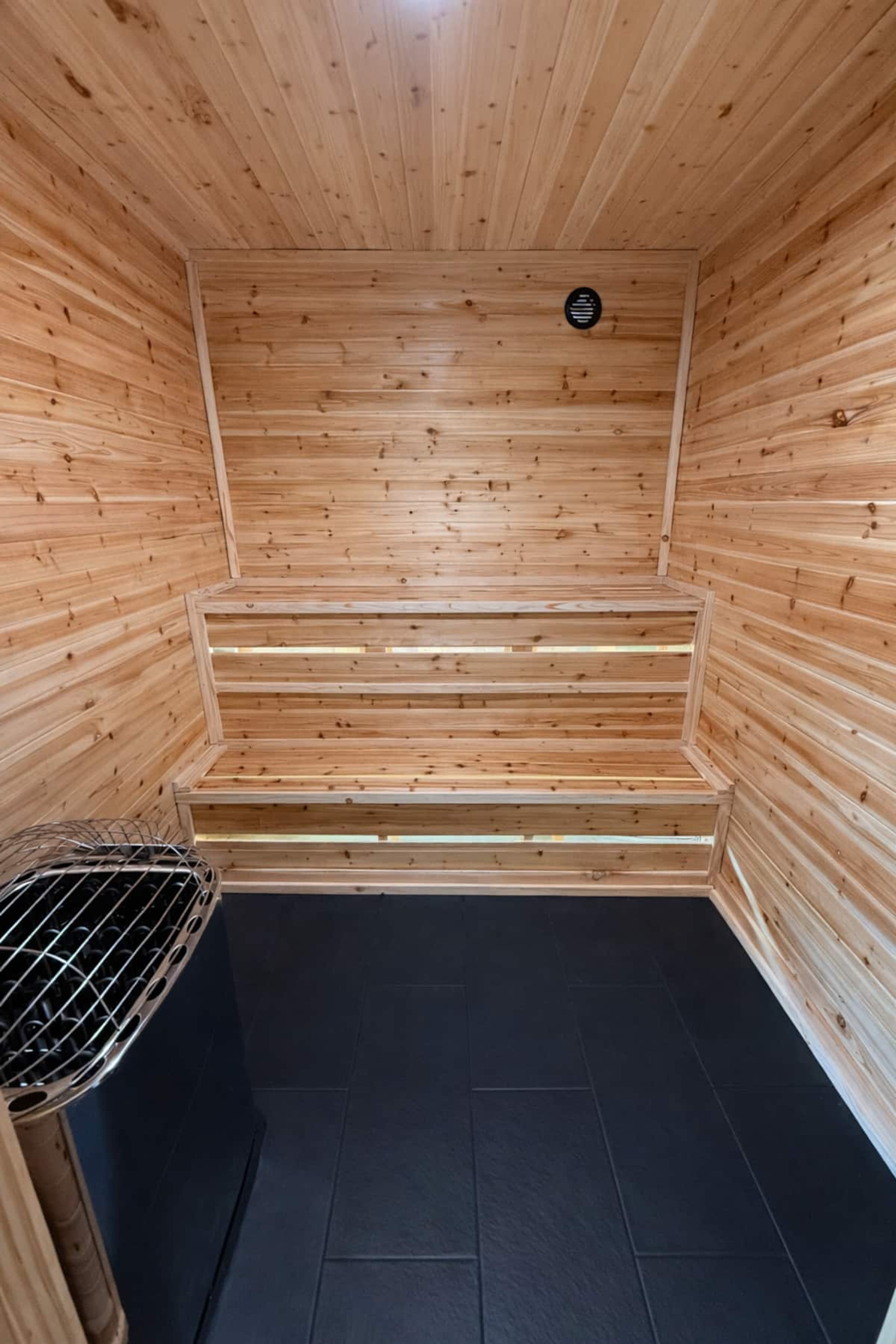 Wood-lined private sauna at Caswell Cabin